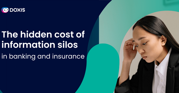 A woman in a blazer looks thoughtfully at her desk, reflecting on information silos in banking.