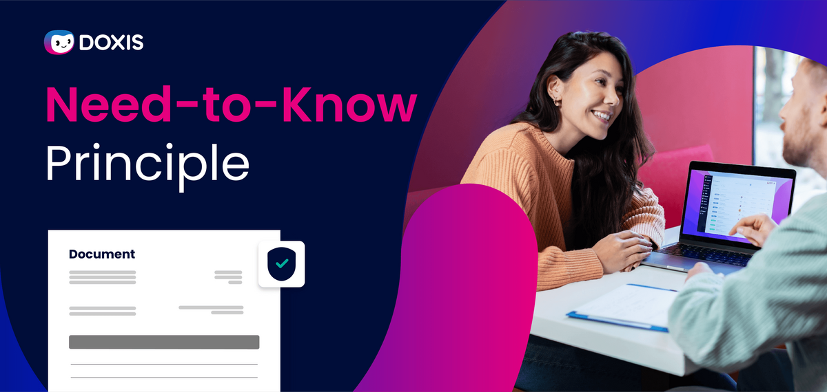 Two people discussing the Need-to-Know Principle with a laptop and documents on the table.