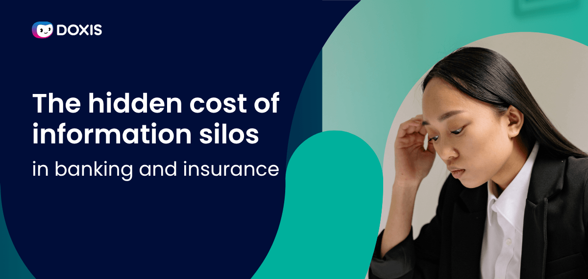 A woman in a blazer looks thoughtfully at her desk, reflecting on information silos in banking.
