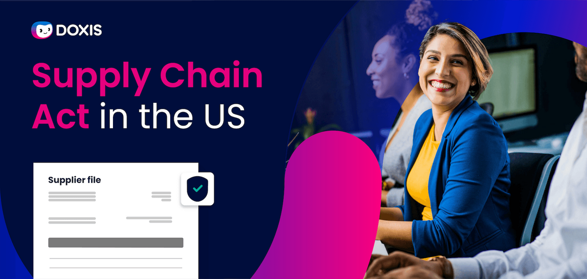 A smiling woman in a blue blazer at a meeting about the Supply Chain Act in the US, with documents visible.